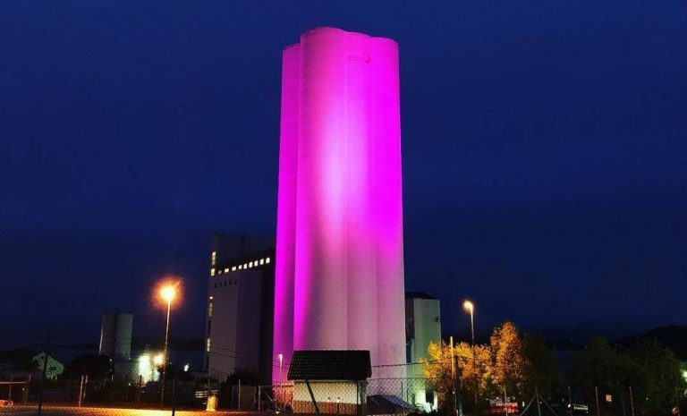 Skretting light up 80-metre silo pink for breast cancer awareness month