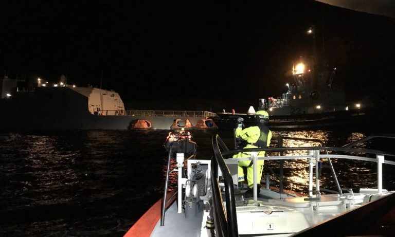 Damaged frigate ran aground after tanker collision in salmon farming region