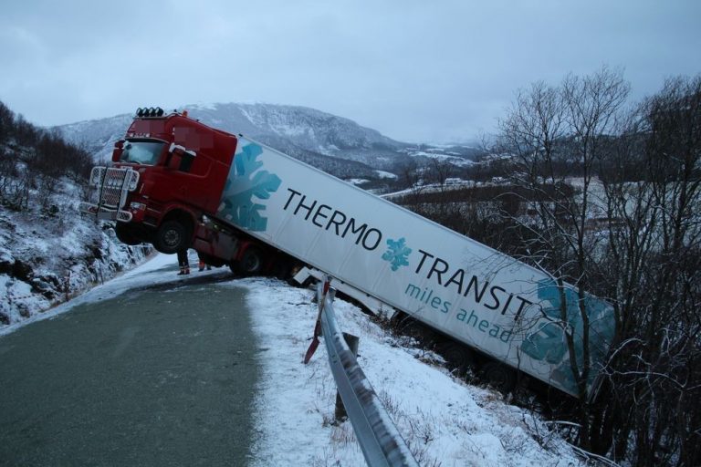 Driver leaps out of salmon transport truck window before it skids off 50m cliff