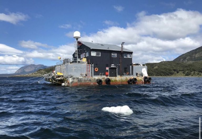 Salmon farmer ordered to monitor sunken feed barge