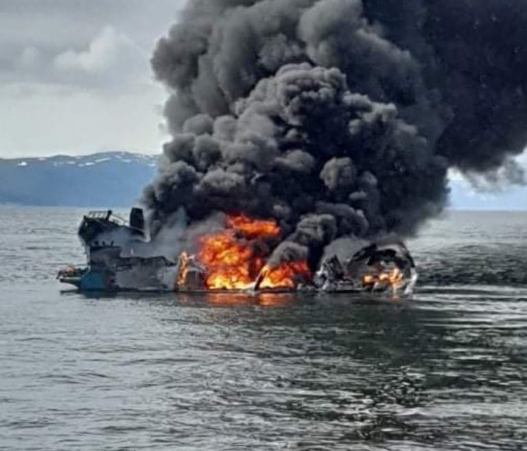 Man rescued from workboat fire