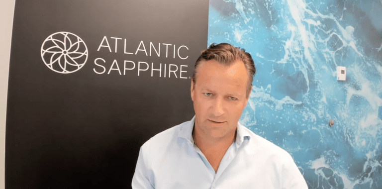 Troubled land-based salmon producer breaches loan agreement